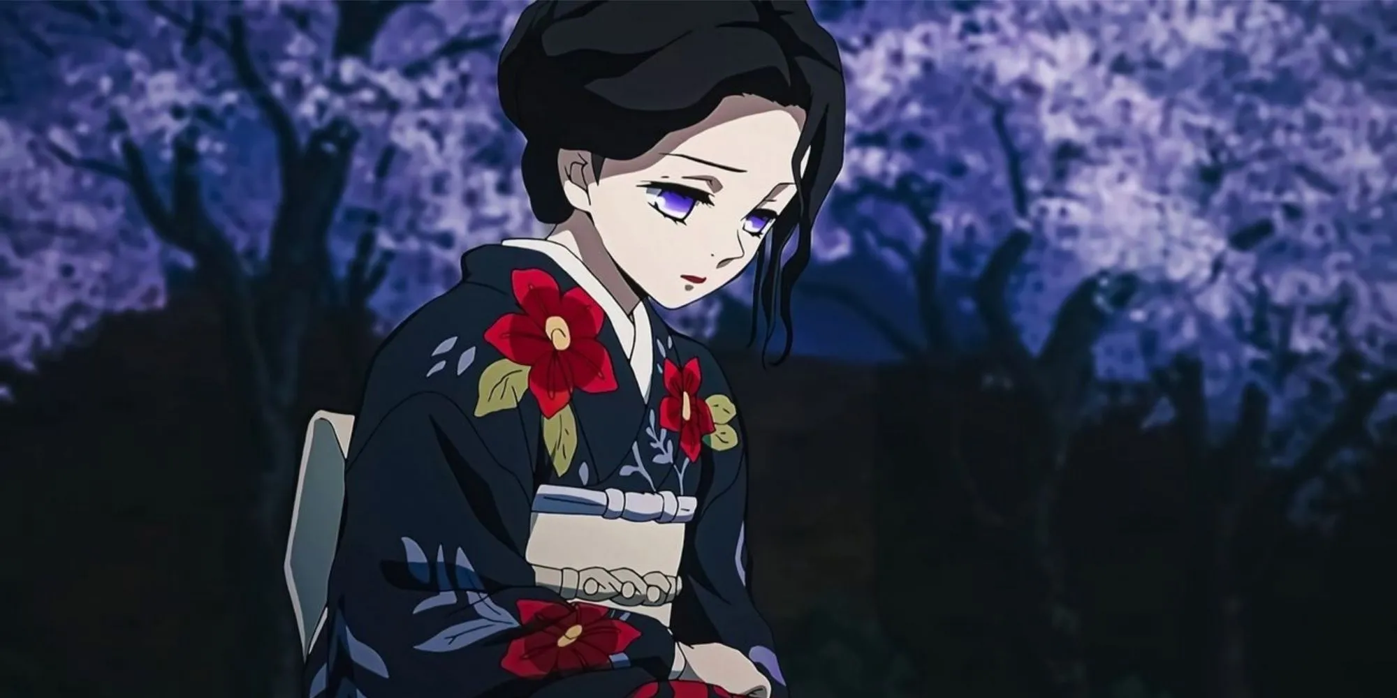Tamayo trong Kimetsu no Yaiba ngồi giữa cây tử đằng