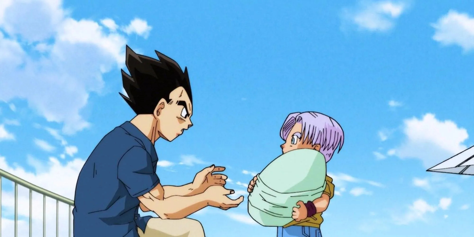 Vegeta ôm con gái Bulla, bên cạnh là Trunks