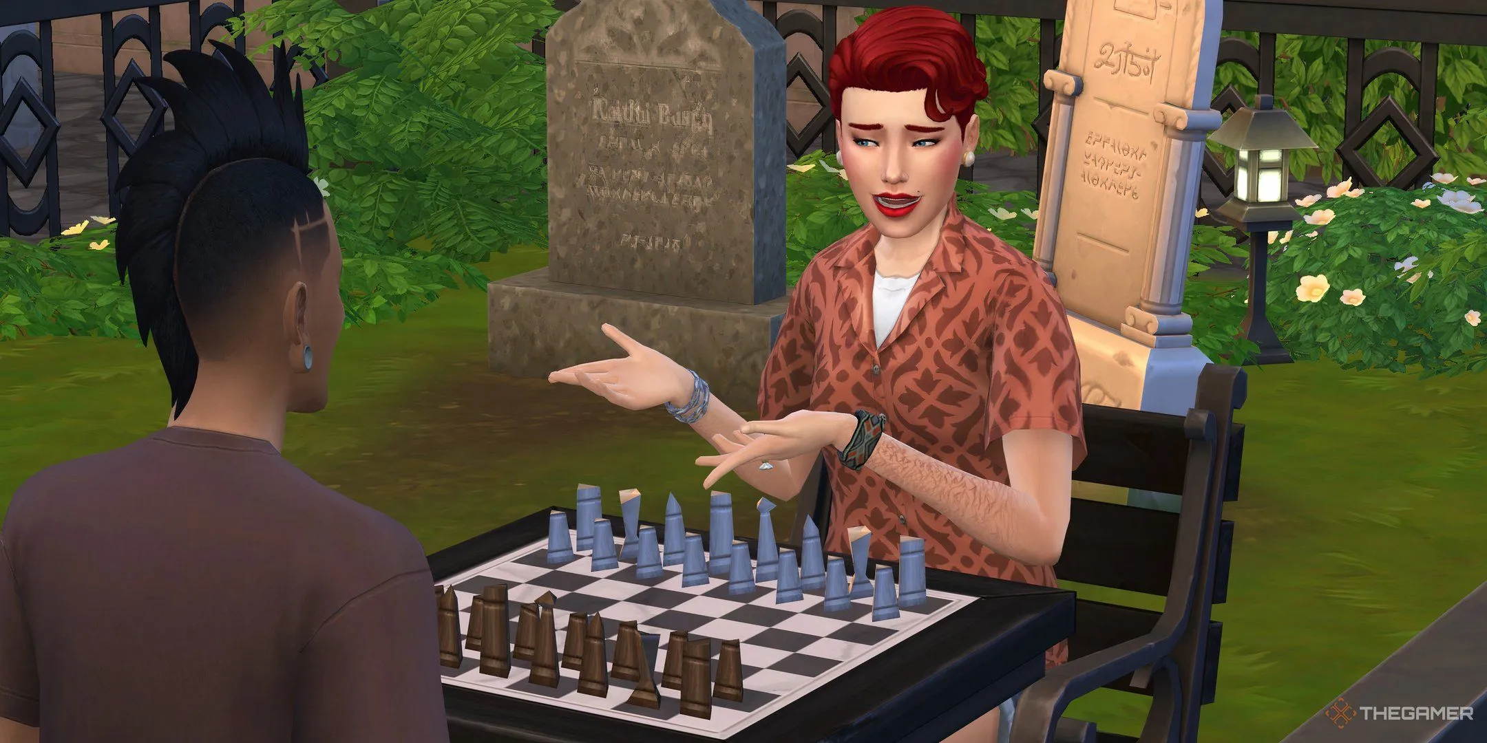 Hai nhân vật Sims chơi cờ vua gần các ngôi mộ trong The Sims 4