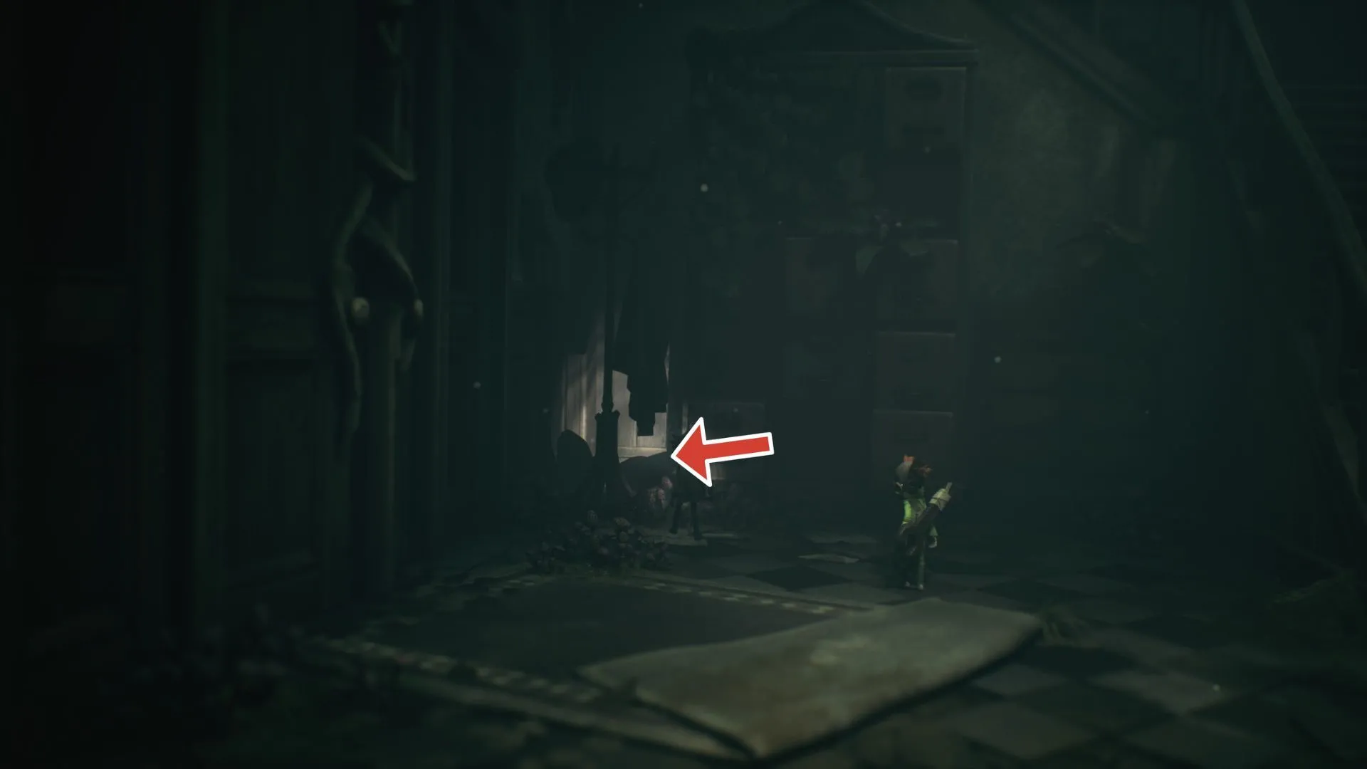 Ghost #4 nằm gần tủ và móc áo ở góc phòng trên lầu trong Little Nightmares 3